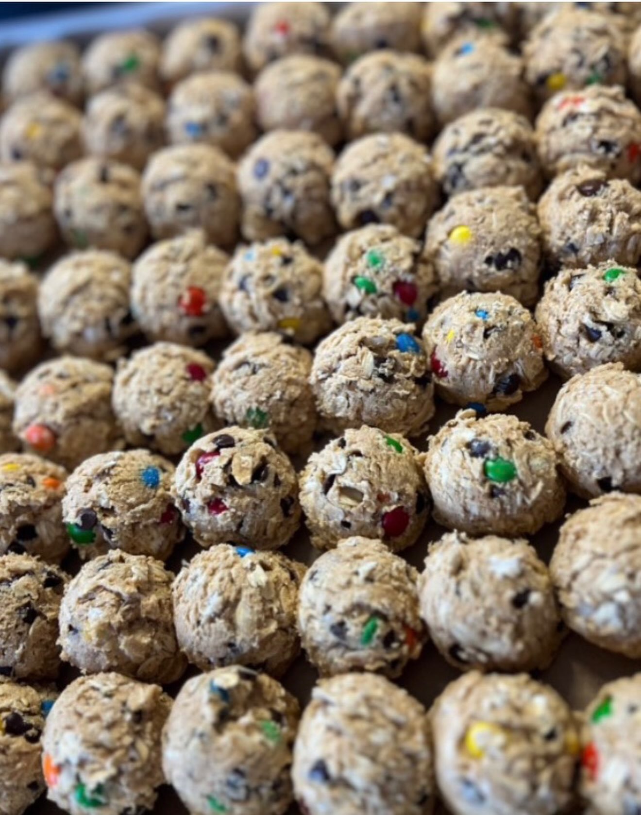 Tray of Monster Cookie Dough protein bombs studded with mini M&M candies
